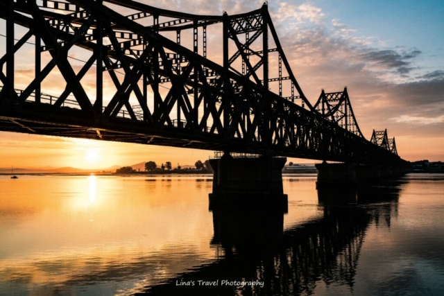 At borderline, China Korea Friendship Bridge over Yalu River, Dandong, Liaoning, China//Xinuiju, North Korea (DPRK)