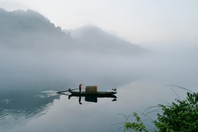 Fisherman from misty East Lake early in the morning, Dongjiang, Zixing, Chenzhou, Hunan, China