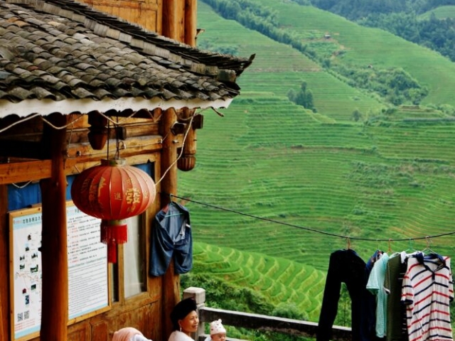 Daily life of mother and baby, Yao ethnic people group, Jingkeng, Dazhai, Hongyao Rice Terraces, Longji, Guangxi, China