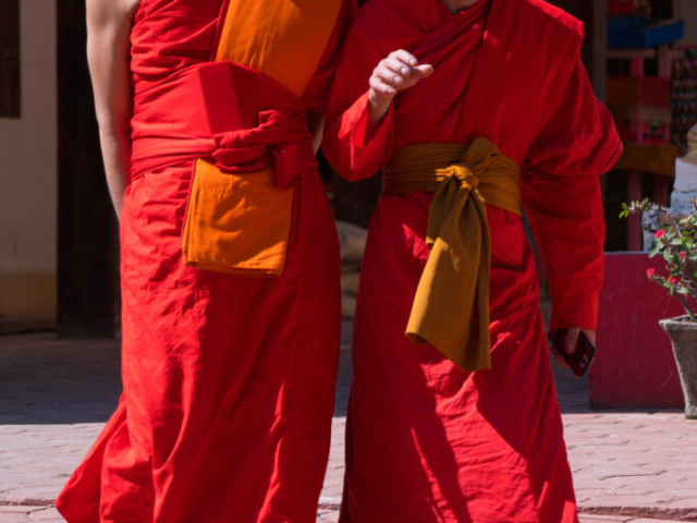 Colorful and happy monks in Vat That, Vang Vieng, Laos