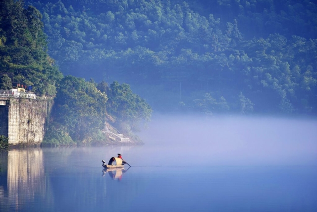 Dreamlike fishing a misty morning at East Lake, Dongjiang County, Zixing, Chenzhou, Hunan, China