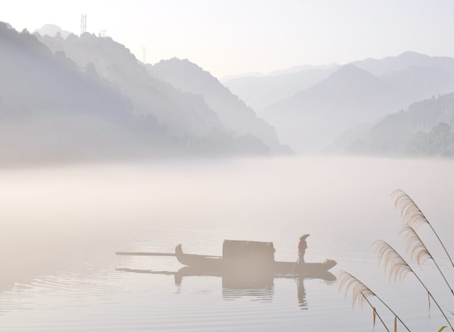 Dreamlike fishing a misty morning at East Lake, Dongjiang County, Zixing, Chenzhou, Hunan, China