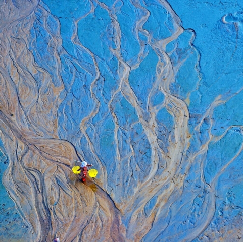 Fishermen wandering on low tide beach in sunset, Xiapu, Fujian, China